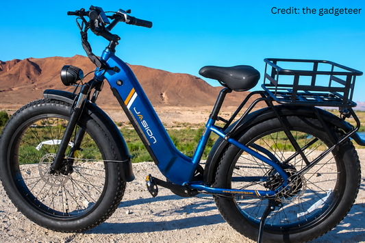Jasion EB7 folding fat tire electric bike parked outdoors with integrated headlight and rear rack